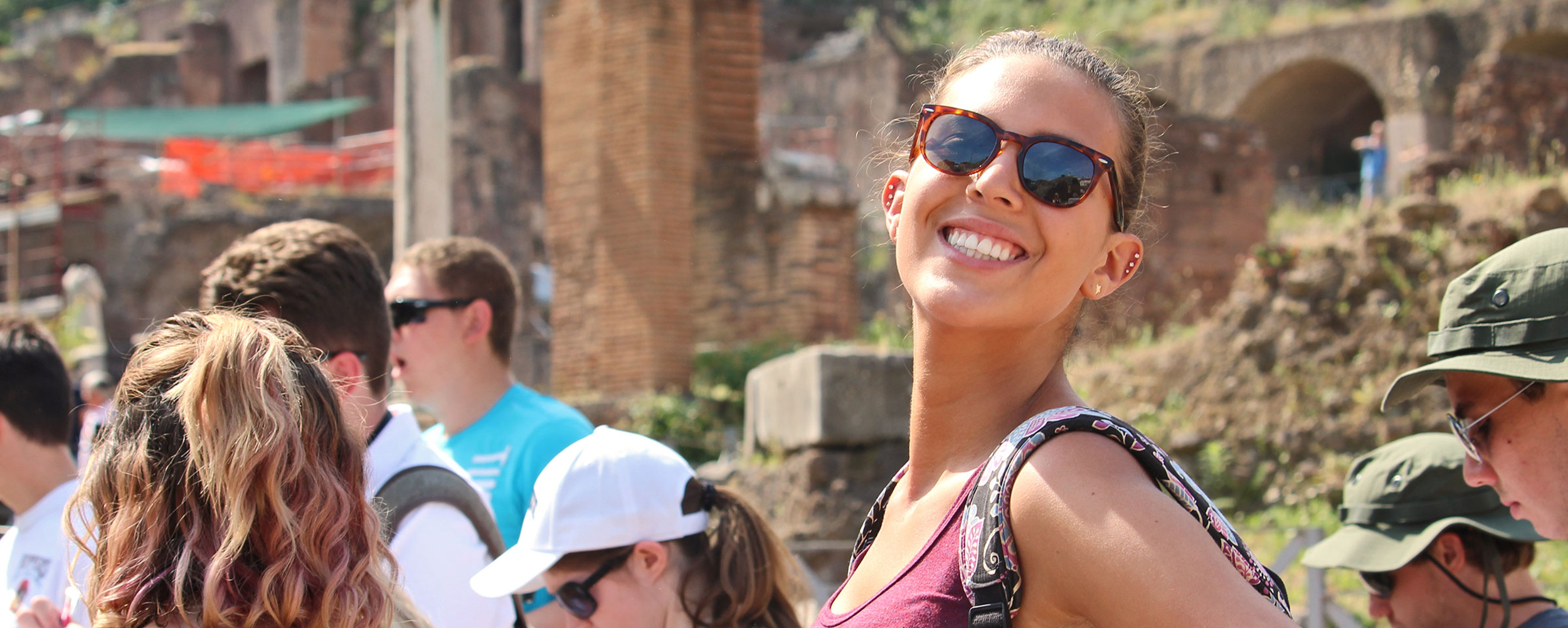 student in rome smiling